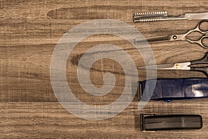 Hair Cutting Tools on a Wood Background