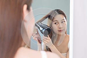 Hair Dryer, happy, asian young woman, girl looking into mirror reflect using hairdryer to dry, blowing long blonde straight after