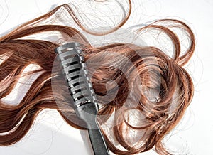 Hair extension dark, close-up on a white background