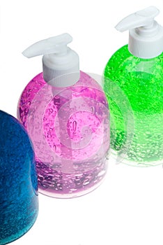 Hair gel bottles over white