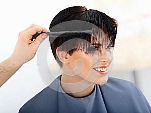 Hair. Hairdresser doing Hairstyle. Beauty Model Woman. Haircut.