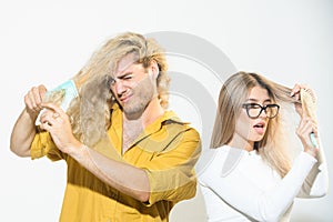 Hair loss man and woman with a comb and problem hair. Hairloss couple with damaged hair. Haircare and loss hair problem