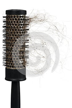 Hair loss problem with round hair brush , isolated on white background. Vertical frame layout