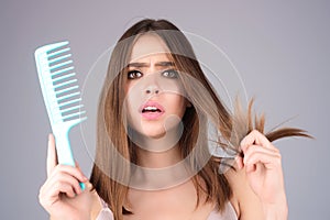 Hair loss woman with a comb and problem hair. Hairloss and hairs problems. Sad girl with damaged hair. Haircare and loss