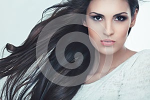 Hair. Portrait of Beautiful Woman with Black Wavy Hair.