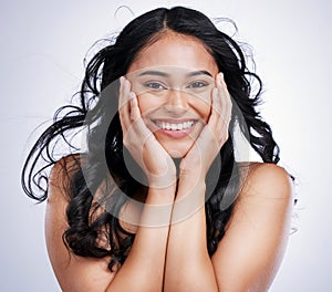 Hair, portrait and Indian woman in studio for beauty, wellness and styling on grey background. Happy, face and female