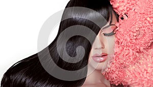 Hair Salon. Beauty Woman with Long Healthy and Shiny Smooth Black Hair. Model Brunette Girl Portrait isolated on a white