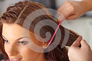 Hair salon. Women`s haircut. Combing.