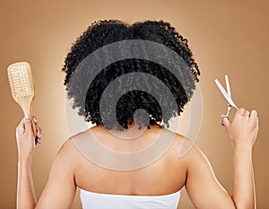 Hair, scissors and brush, woman and back view for beauty and curls with natural cosmetics and shine on studio background