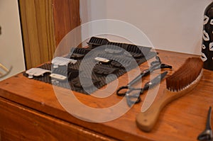 hair shavers and soft brush in barbershop upon the wooden table