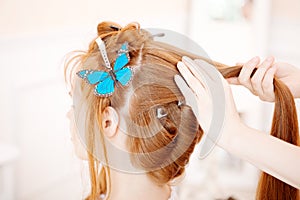 Hair stylist makes the bride on the wedding day