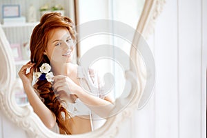 Hair stylist makes the bride on the wedding day