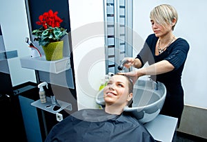 Hair stylist washing hair