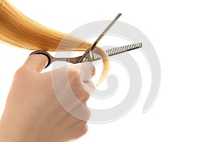 Hair tapering of split ends by scissors.