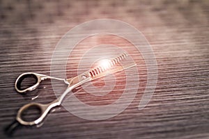 Hair thinning scissors on table in professional hairdressing salon. Selective focus