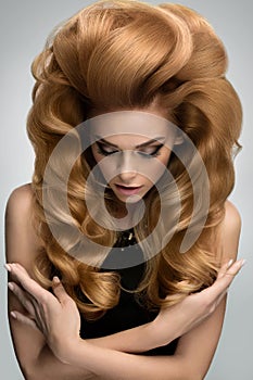 Hair volume. Portrait of beautiful Blonde with Long Wavy Hair.