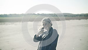 Hair in the wind. A young cheerful girl, beautifully dancing in the open countryside. slow motion