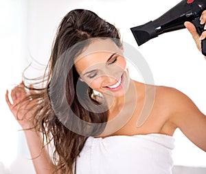 Hair, woman and happy with hairdryer in bathroom, morning routine for grooming and beauty at home. Cosmetology