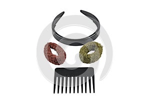 Hairband, comb and bobbles on white background