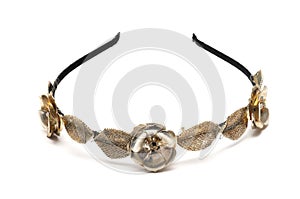 A hairband with metal flowers and leaves decoration