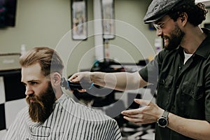 Haircut men Barbershop. Men& x27;s Hairdressers barbers. Barber cuts the client machine for haircuts