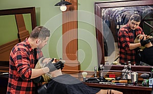 Haircutting is an art. moustache and beard. sit in chair at hairdresser. mature man at hairdresser. Hair care and male
