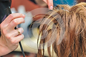 Hairdresser applying hair gel