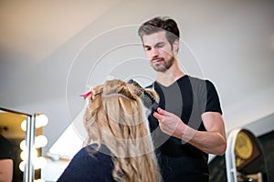 Hairdresser and blonde cliente photo