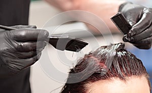 Hairdresser coloring hair