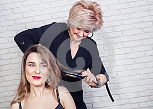 Hairdresser curling hair