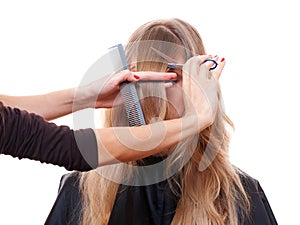 Hairdresser cutting models fringe