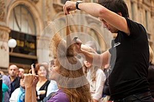 Hairdresser cutting woman`s hair