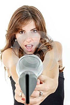 Hairdresser holding hairdryer like gun and pointing at camera