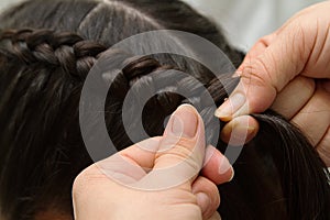 Hairdresser make braids