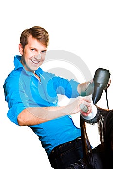 Hairdresser man drying with hair dryer on white