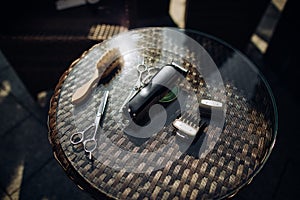 Hairdresser`s tools: scissors, comb, brush, trimmer on the table