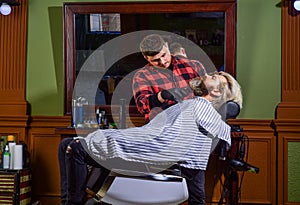 Hairdresser salon. Shaving with razor. Facial hair. Maintaining beard shape. Grow beard and mustache. Man at barbershop