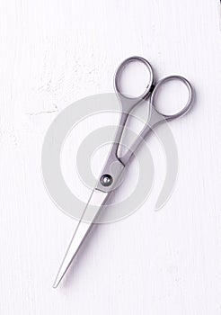 Hairdresser scissors shot on top of the white