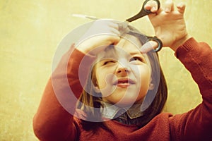 Hairdresser shutting eye from fear while cutting hair