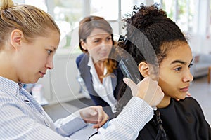 hairdresser straightening hair