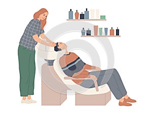 The hairdresser washes her client s hair in preparation for the haircut