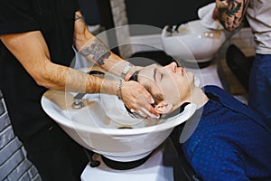 Hairdresser washing head client