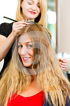 At the hairdresser - woman gets new hair colour