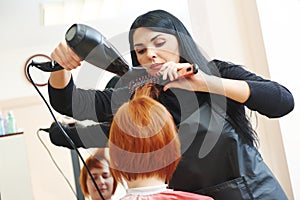 Hairdresser at work. Drying hair