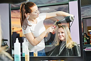 Hairdresser at work. Drying hair