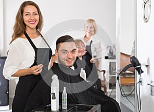 Hairdressers and clients in hair salon