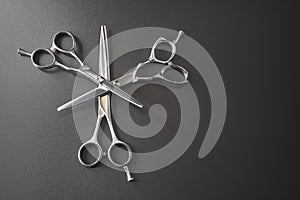 Hairdressing different scissors isolated over black