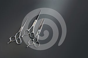 Hairdressing different scissors isolated over  black background