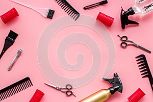 Hairdressing mockup - with brush, spray and sciccors - on pink background top-down frame copy space