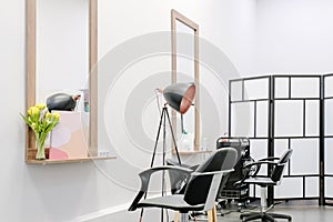 Hairdressing salon chairs and equipment is ready to receive visitors